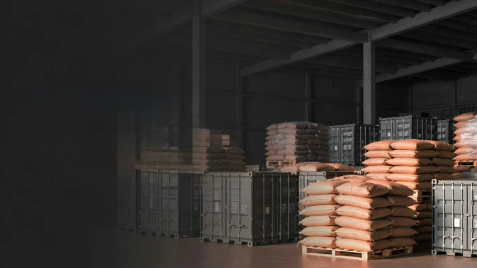 Stacks of sacks and containers in a warehouse